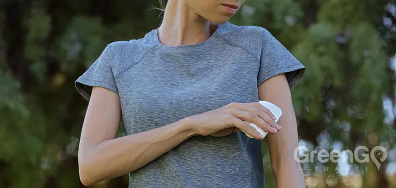 Bugs in Galapagos - Hiker Applying Repellent Cream