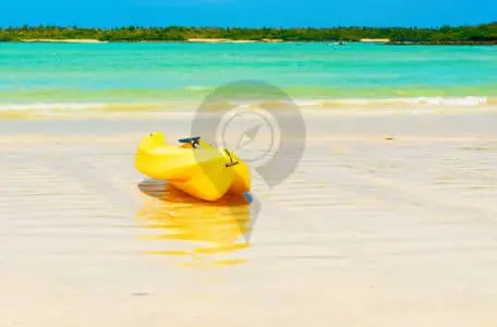 Hawaii-Versus-Galapagos-Kayak-on-beautiful-white-beach