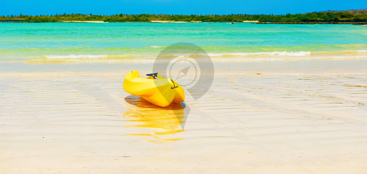Hawaii-Versus-Galapagos-Kayak-on-beautiful-white-beach
