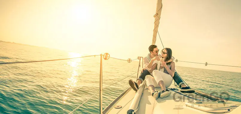Tip-Top-V-Galapagos-Cruise-Honeymoon-Experience-Honeymoon-CoupleSitting-on-Sailboat