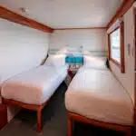 Coral-Galapagos-Yachts-junior-cabin-twin-bed